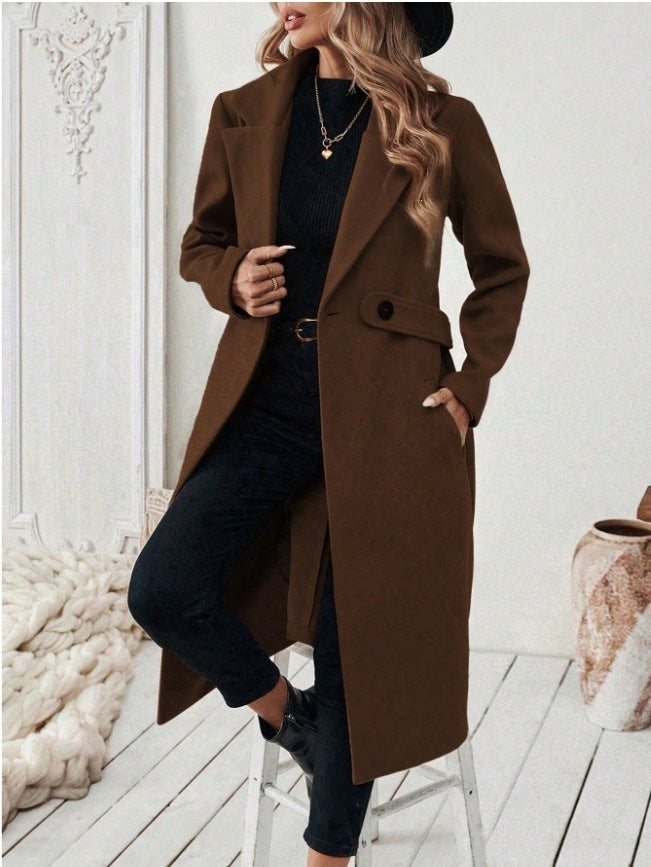 Brown wool long double-breasted coat with notched lapels, flap pockets, and button front.