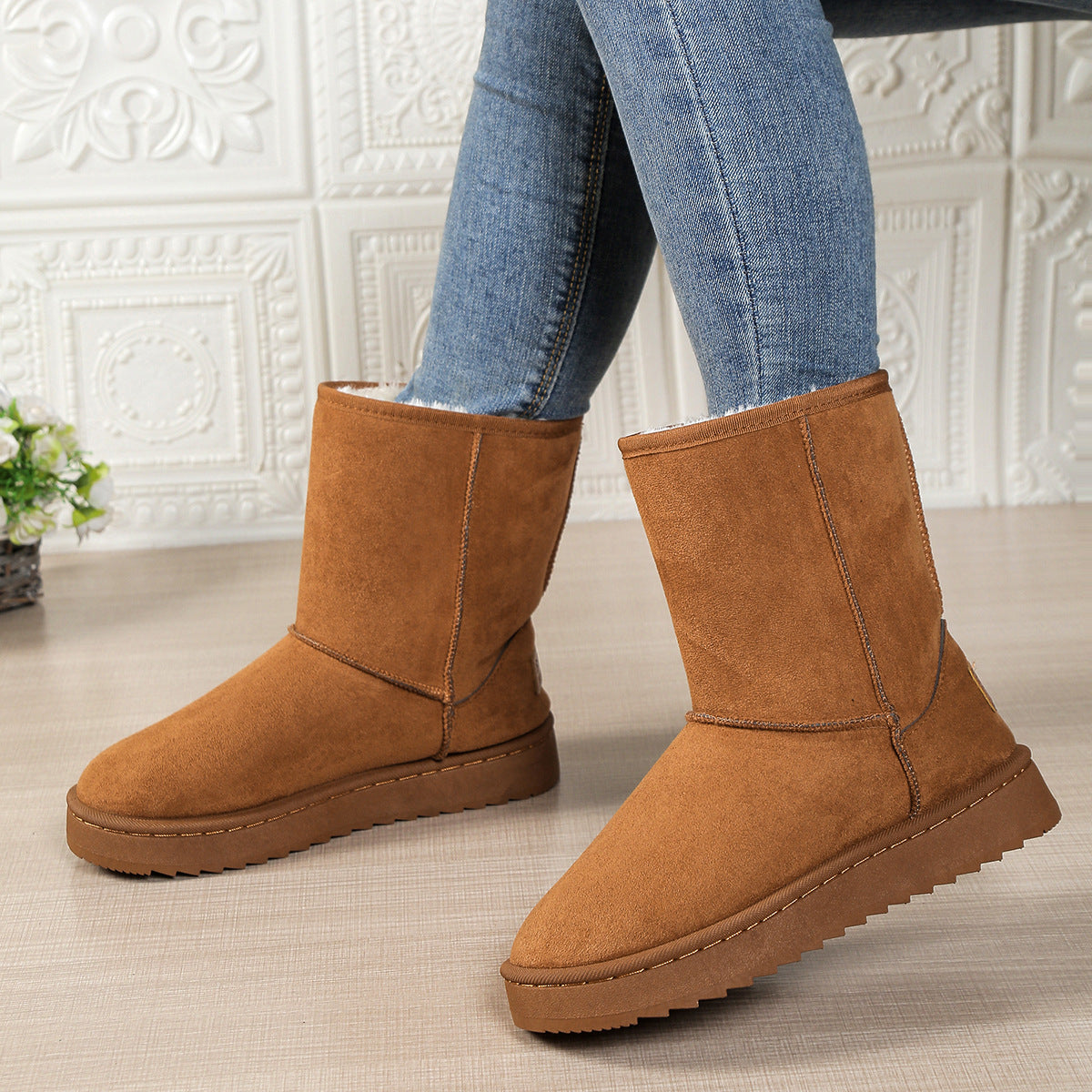 Women’s mid-calf fleece-lined slip-on snow boots in tan brown with flat rubber sole