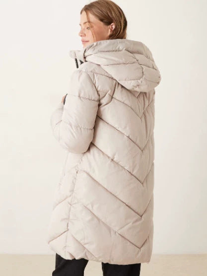 Cream long puffer down jacket with hood, quilted stitching, and zip front.