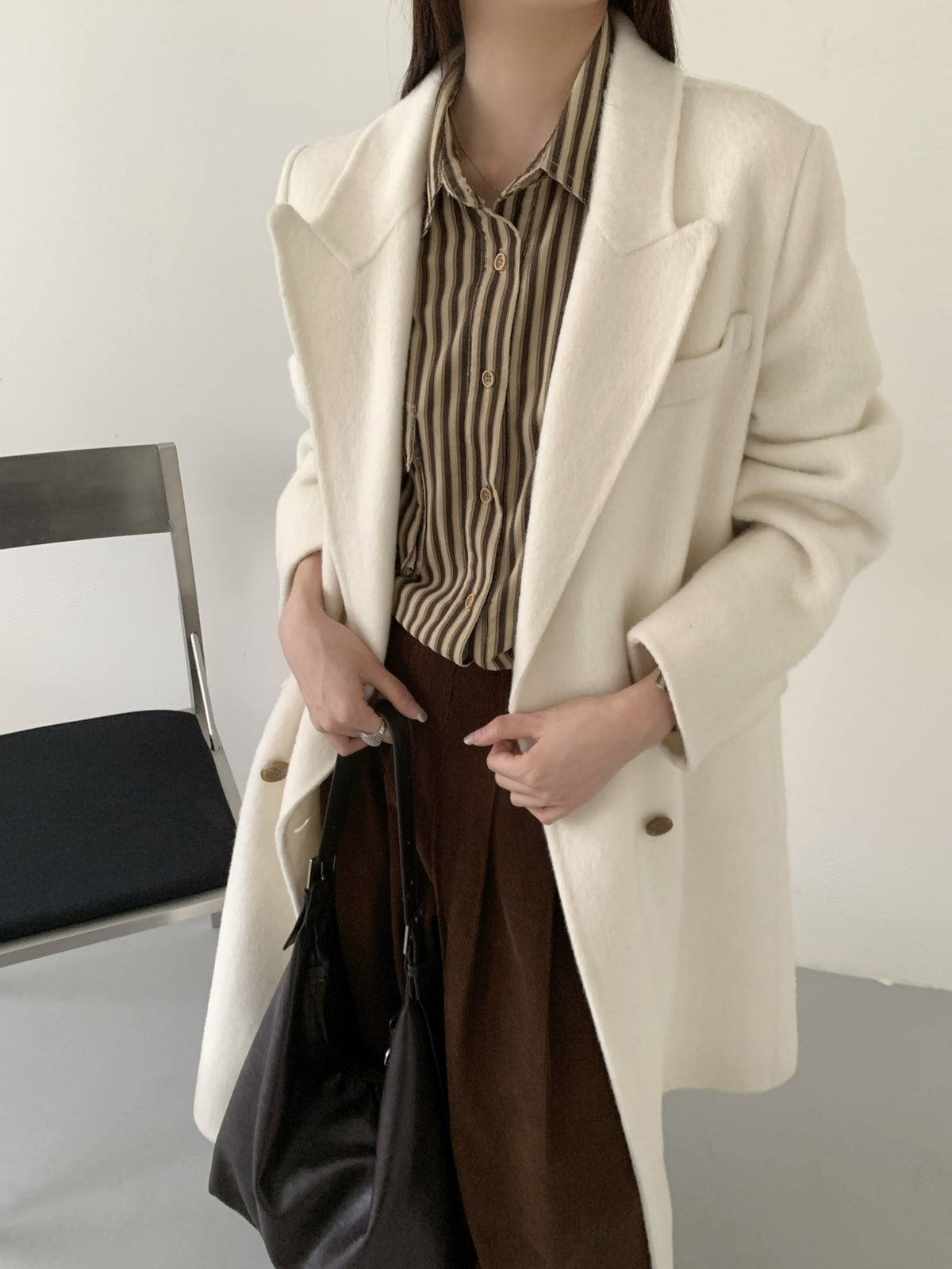 Off-white long double-breasted cashmere coat with high collar and metal-tone buttons