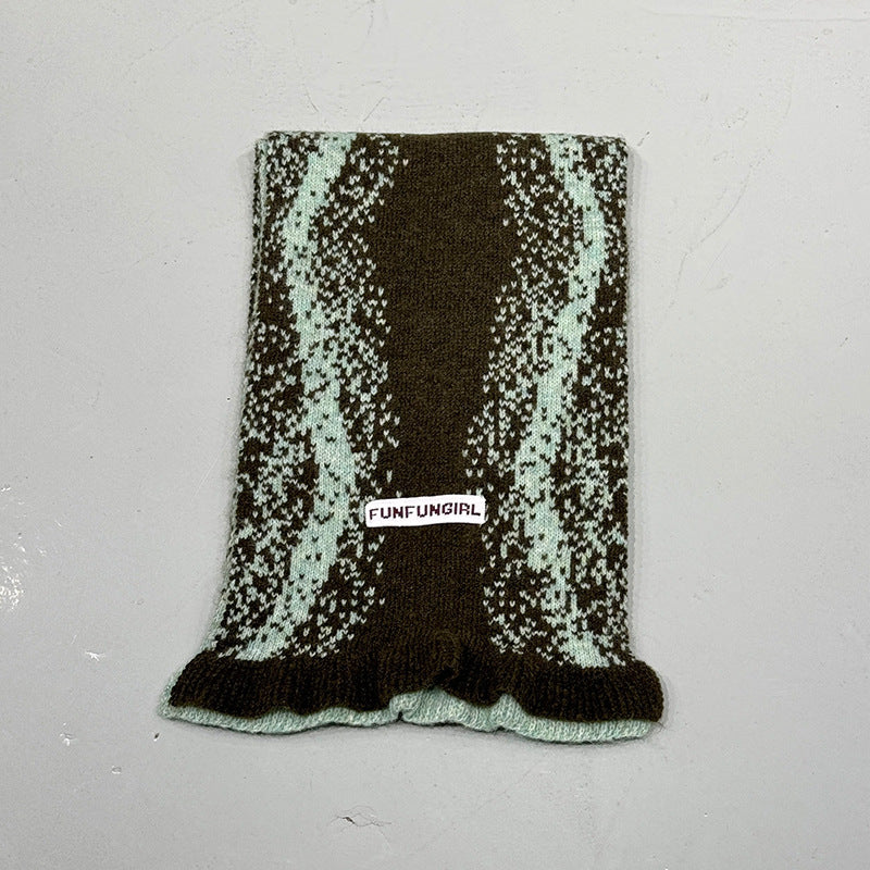 Dark green speckle knitted scarf with fringed bottom edge and label patch
