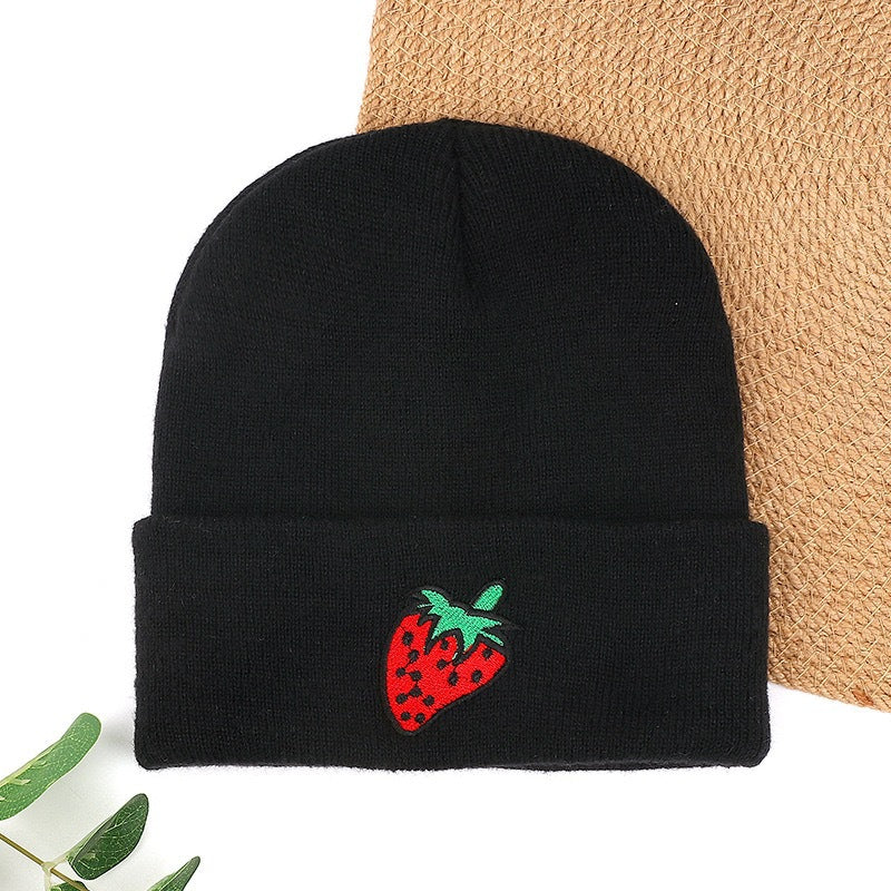 Black knit beanie with red strawberry embroidery