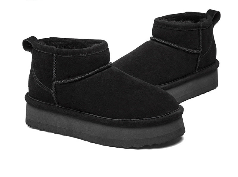 Black suede slip-on snow boots with fleece lining and flat tread sole
