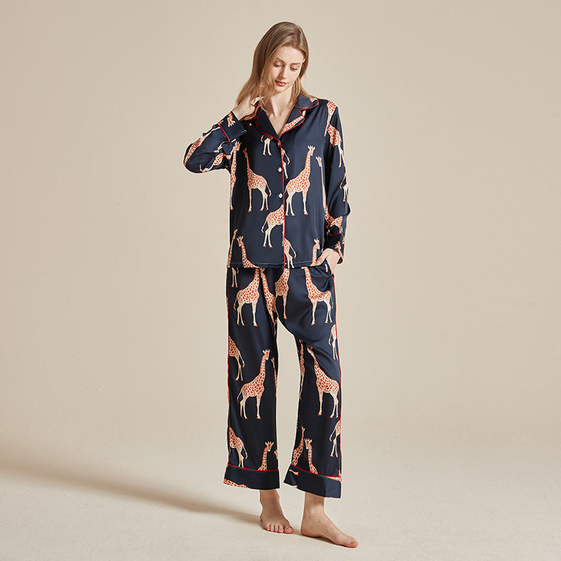 Women’s long-sleeve pajama set in dark navy with giraffe and animal prints