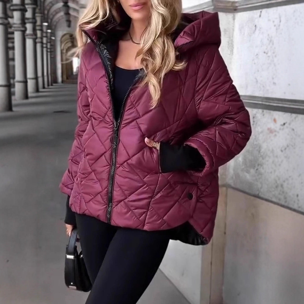 Maroon quilted hooded jacket with zip front, padded shoulders, diamond quilting, side pockets