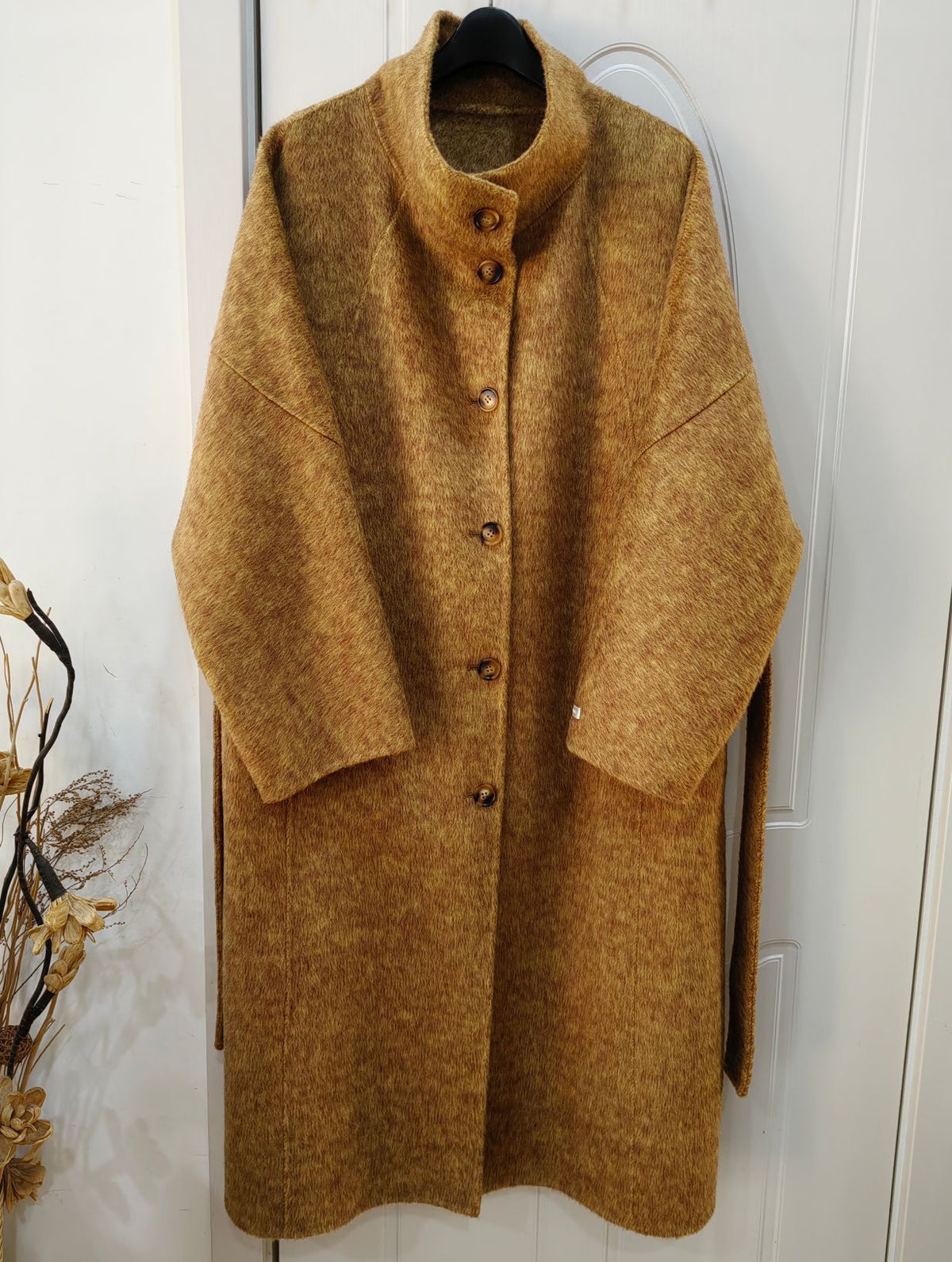 Brown long wool coat hanging, stand collar, button front, tie-waist belt