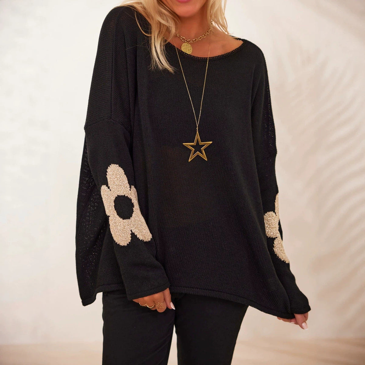 Black floral jacquard pullover sweater, round neck, loose fit, long sleeves.