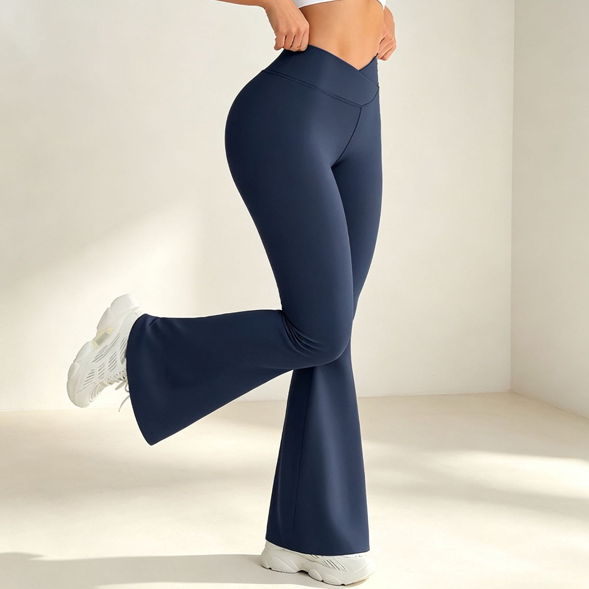 Dark brown high-waist flared yoga pants with fitted waist and wide bell hems