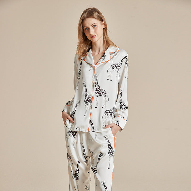 Women’s long-sleeve pajama set with white base, black animal print, orange piping