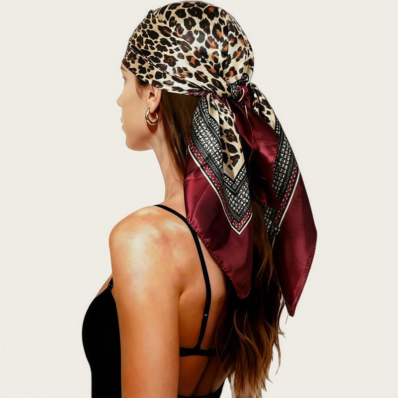 Leopard print silk square scarf with dark knot, satin sheen