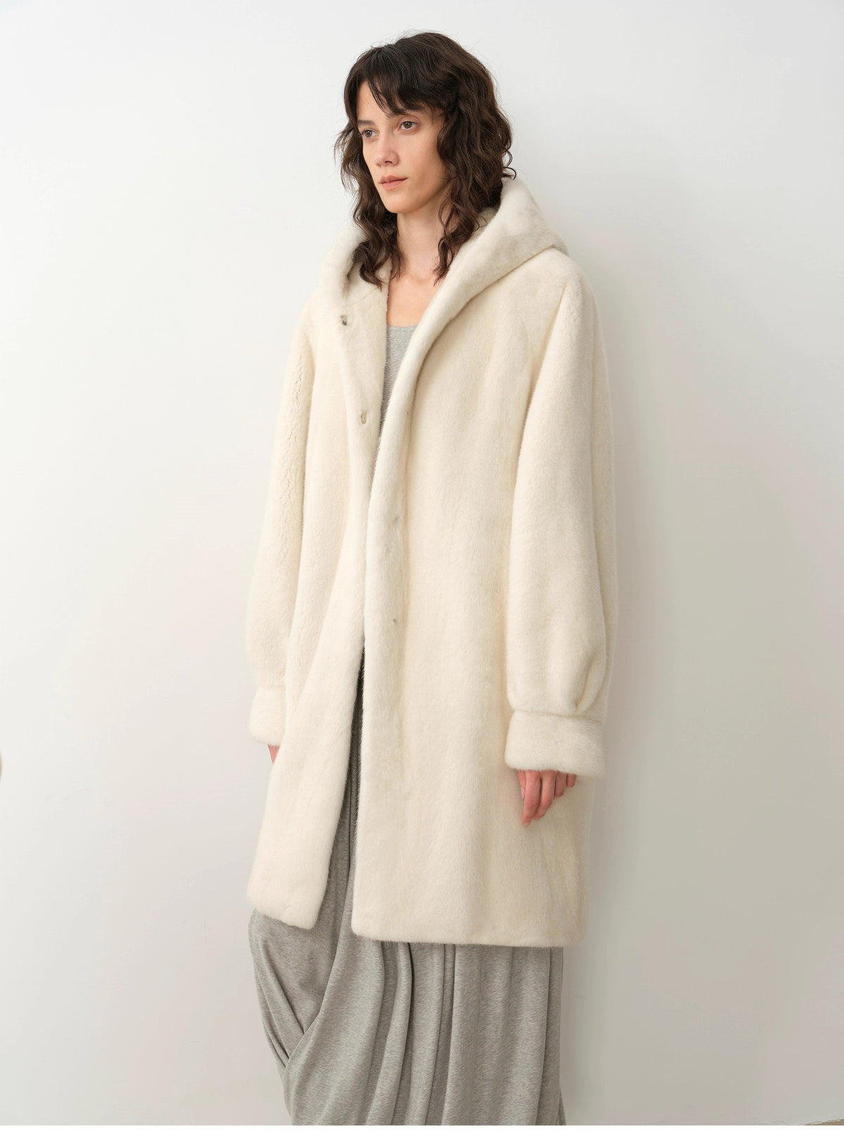 Ivory hooded faux fur coat, button front, mid-length with dropped shoulder
