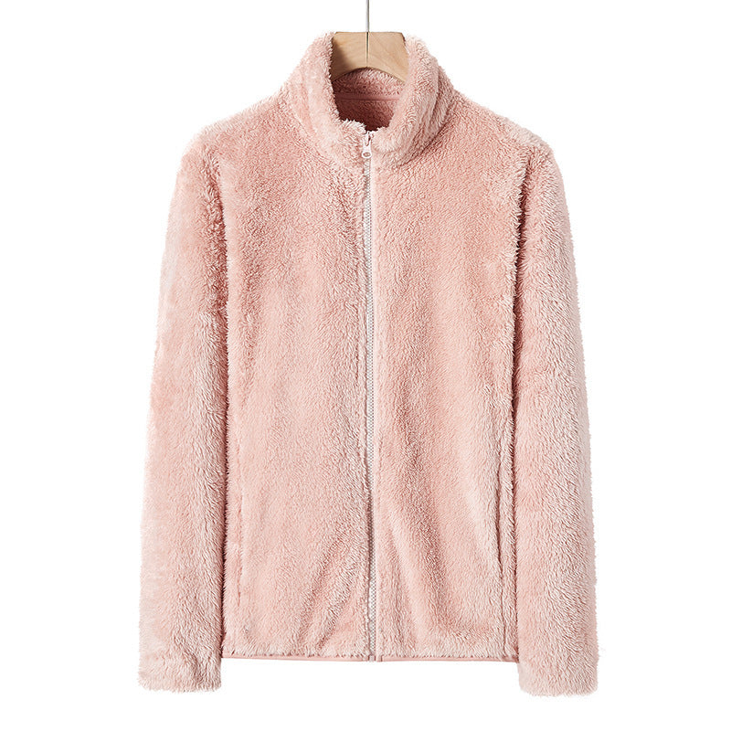 Peach pink fleece zip jacket with stand collar, front view on hanger