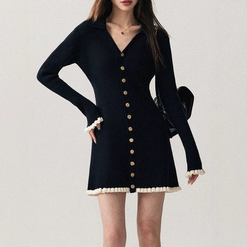 Black collared knit mini dress with long sleeves, gold buttons, ruffle hem and cuffs