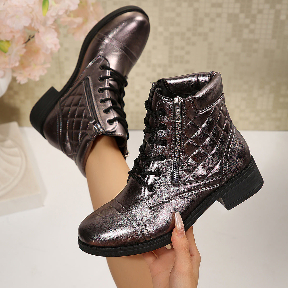 Metallic brown short boots with side zipper, lace-up front, and quilted pattern