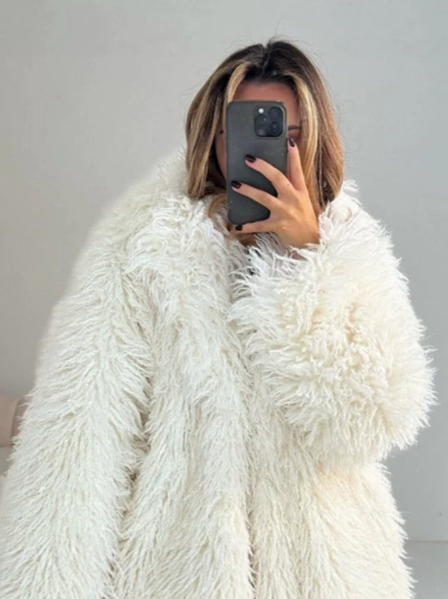 White shaggy fur coat with long sleeves and oversized collar