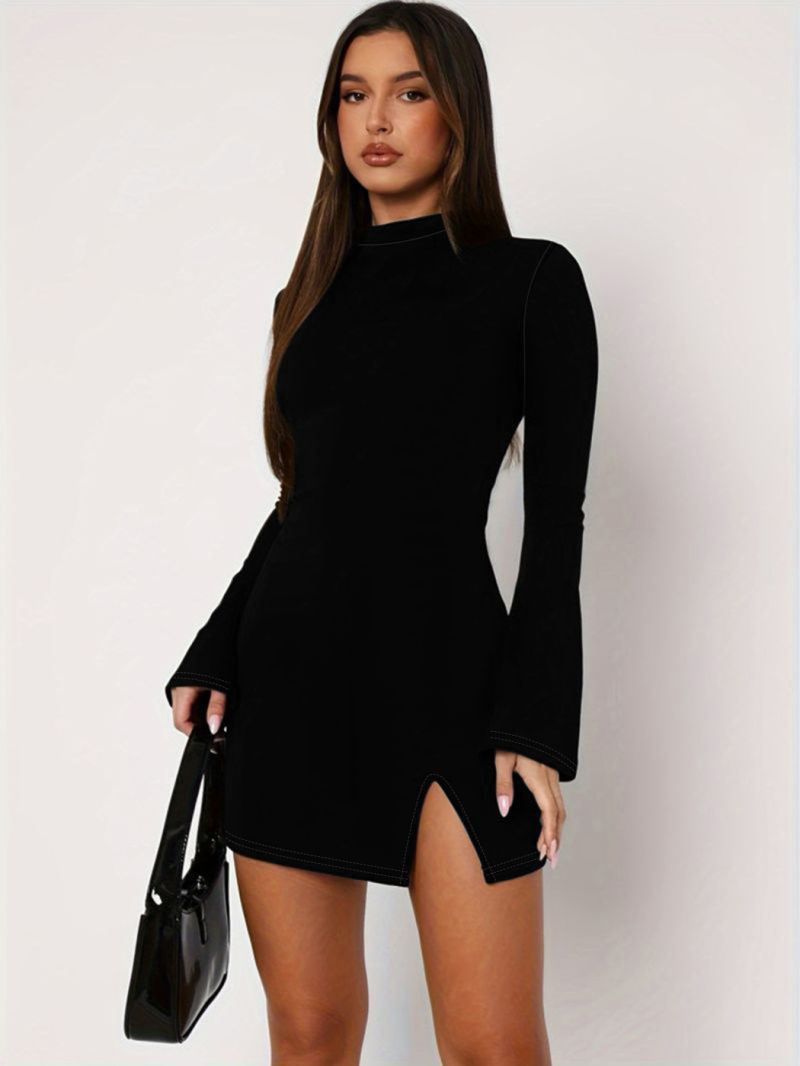 Black mock-neck mini dress with long bell sleeves and front slit, bodycon fit