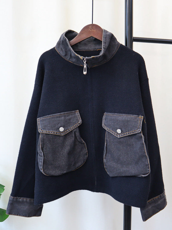 Black zip-front knitted cardigan with gray denim patch pockets and ribbed cuffs