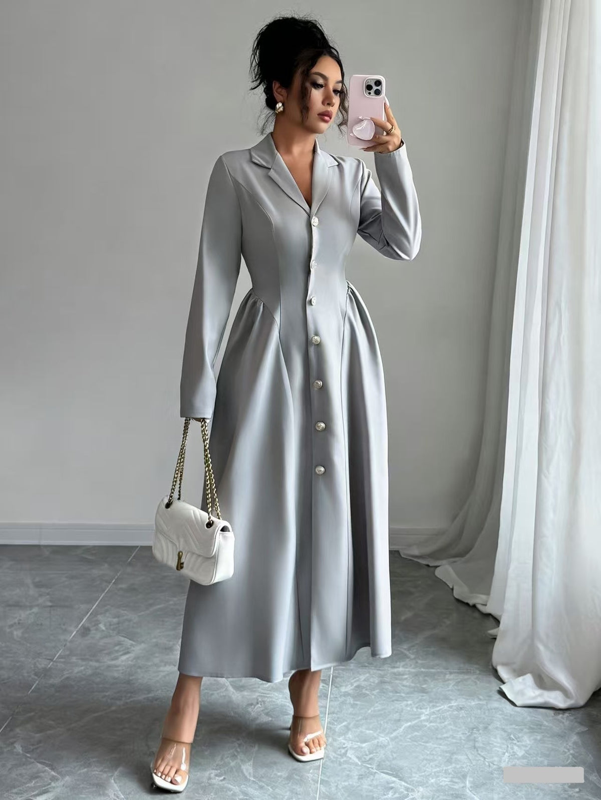 Light gray V-neck long-sleeve button-front dress with fitted waist, over-the-knee length