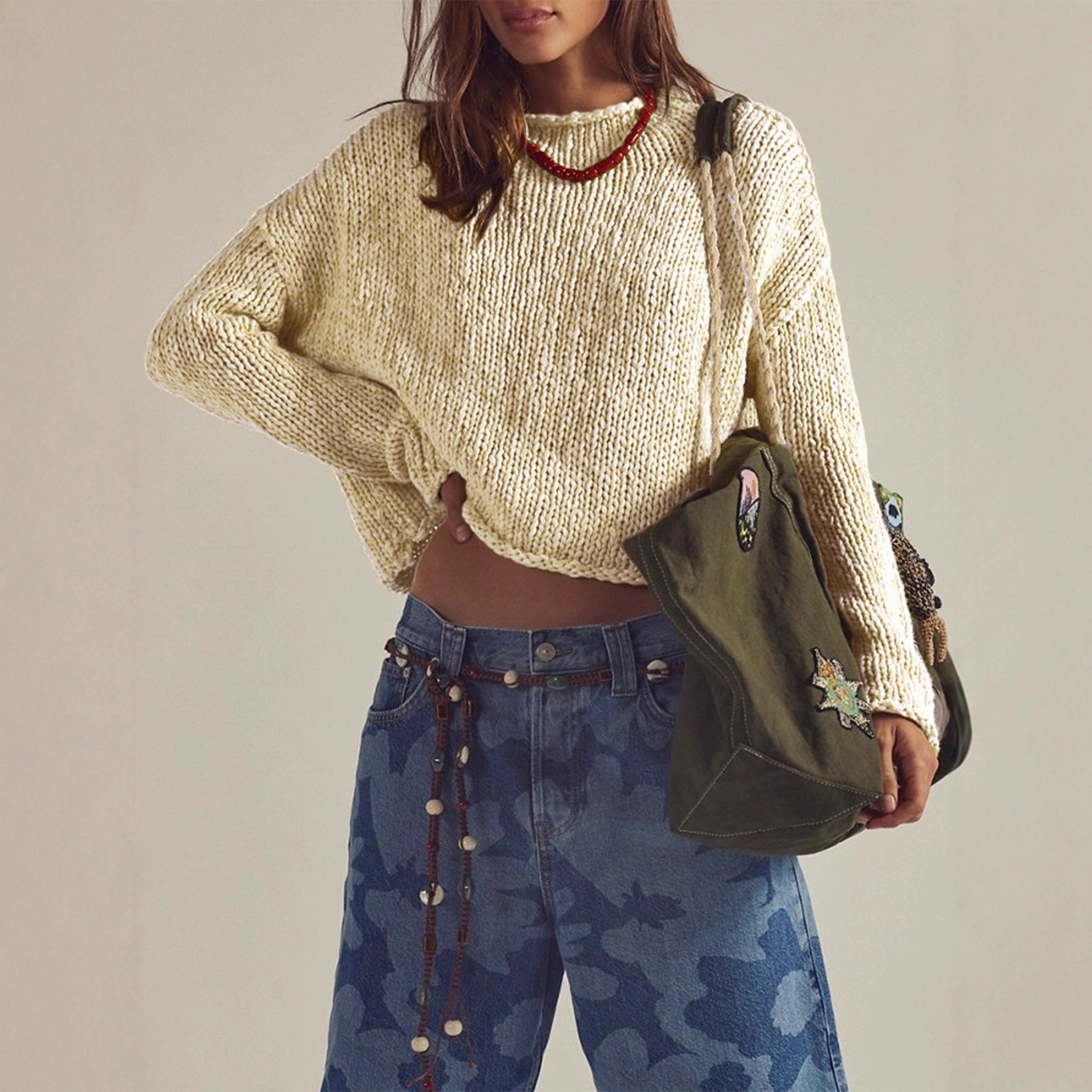 Women’s cream long-sleeve sweater with round neck, textured knit and ribbed cuffs