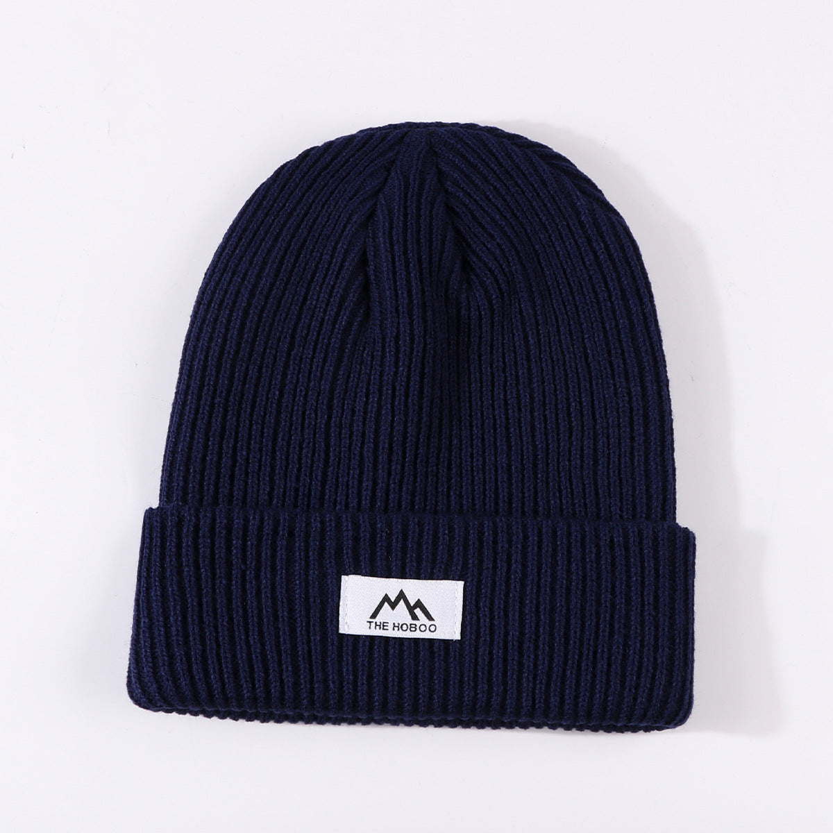 Navy ribbed knit beanie with cuff and small front logo label