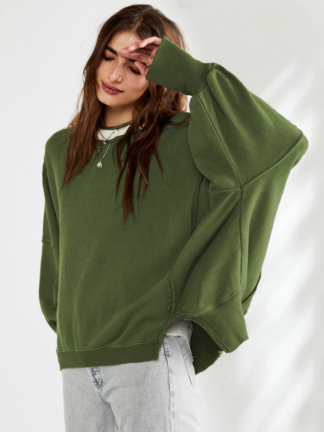 Military green oversized sweatshirt with a crew neck and dropped shoulders