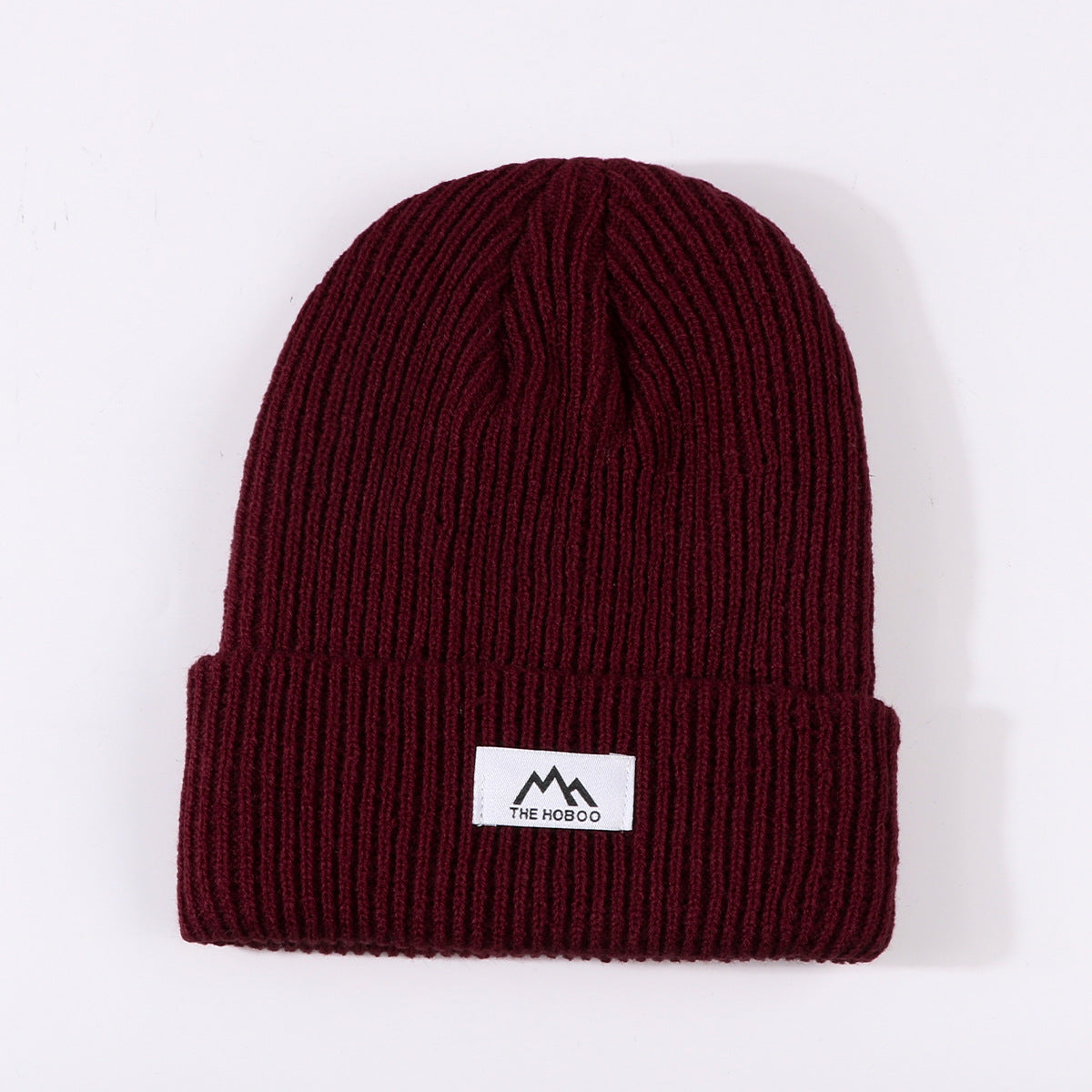 Burgundy ribbed knit beanie with cuff and small front logo label
