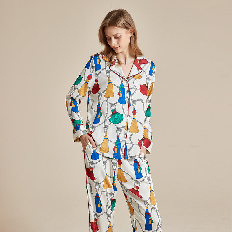 Women’s long-sleeve printed pajama set with colorful carousel horse motifs