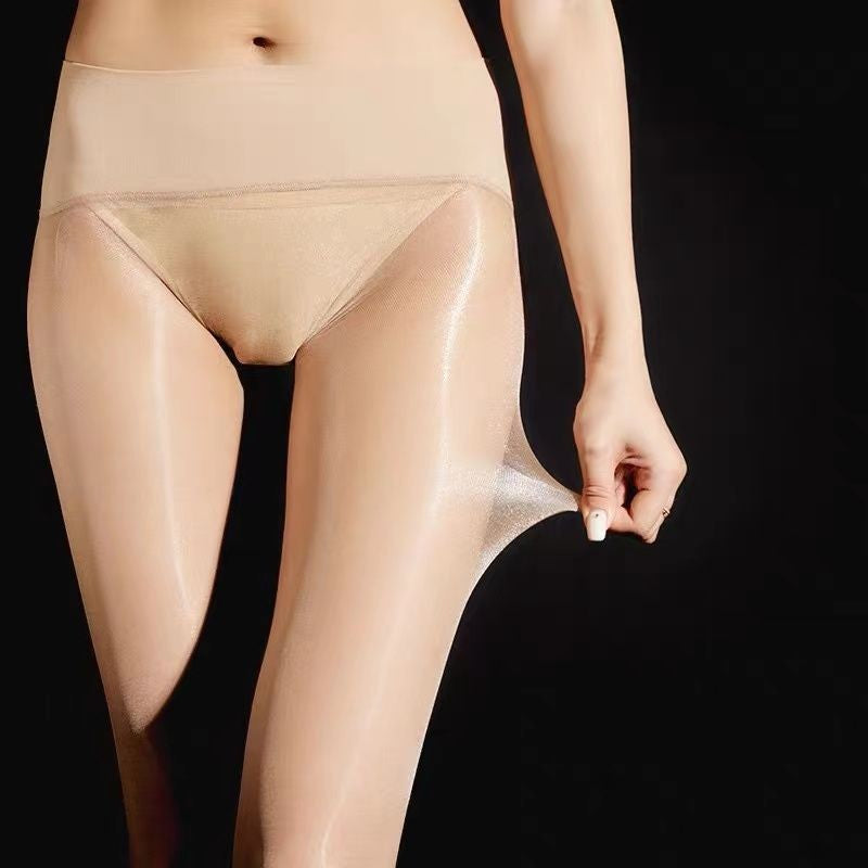Sheer skin-tone pantyhose with a wide beige waistband, stretched at the thigh.