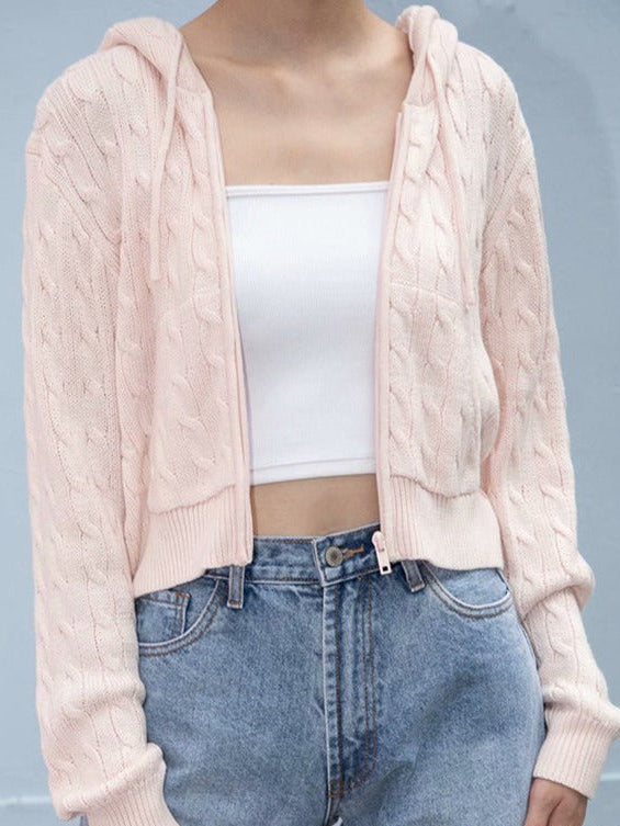 Light pink cropped cable-knit zip-up hoodie with ribbed cuffs and front pockets
