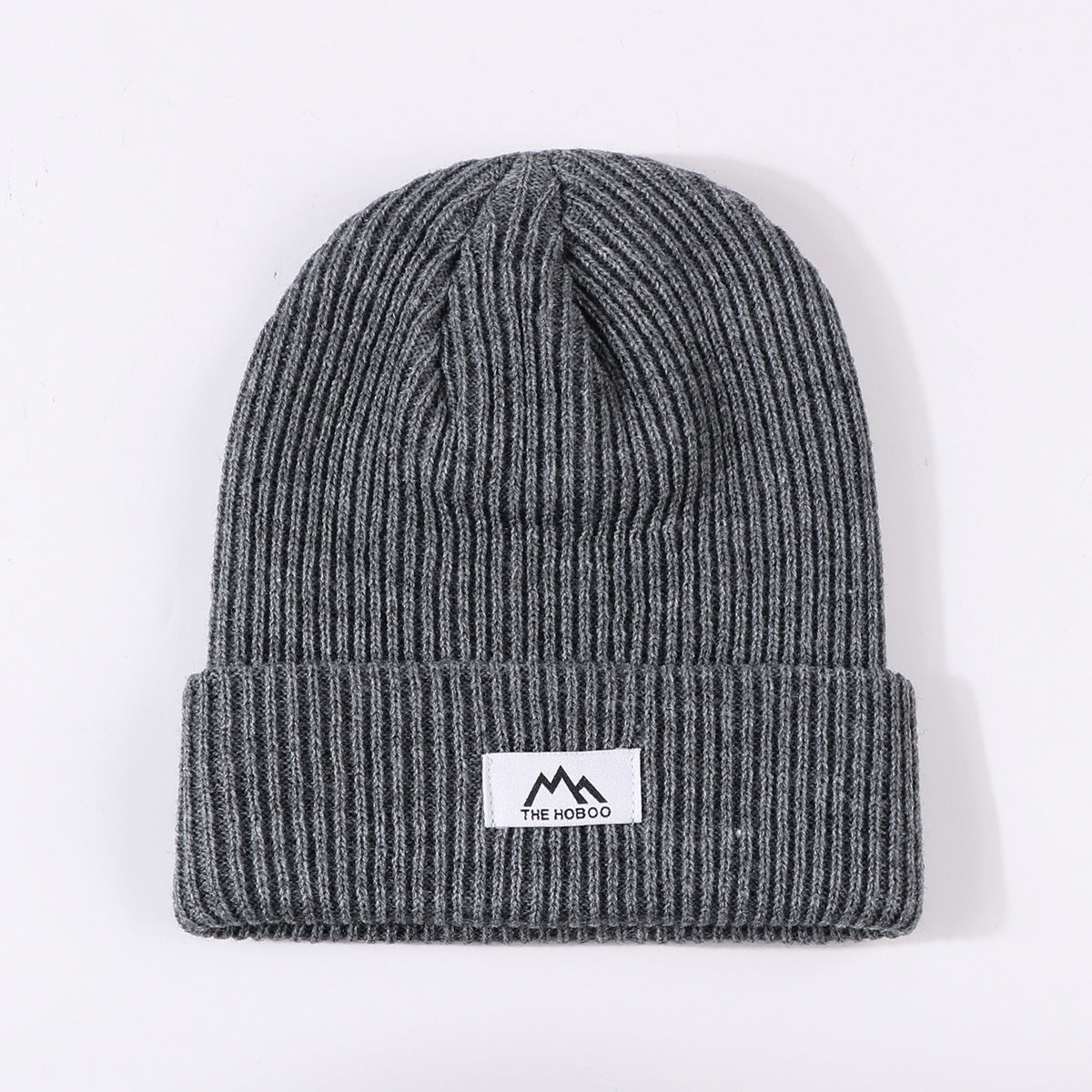 Dark gray ribbed knit beanie with fold-up cuff and THE HOBOO logo patch