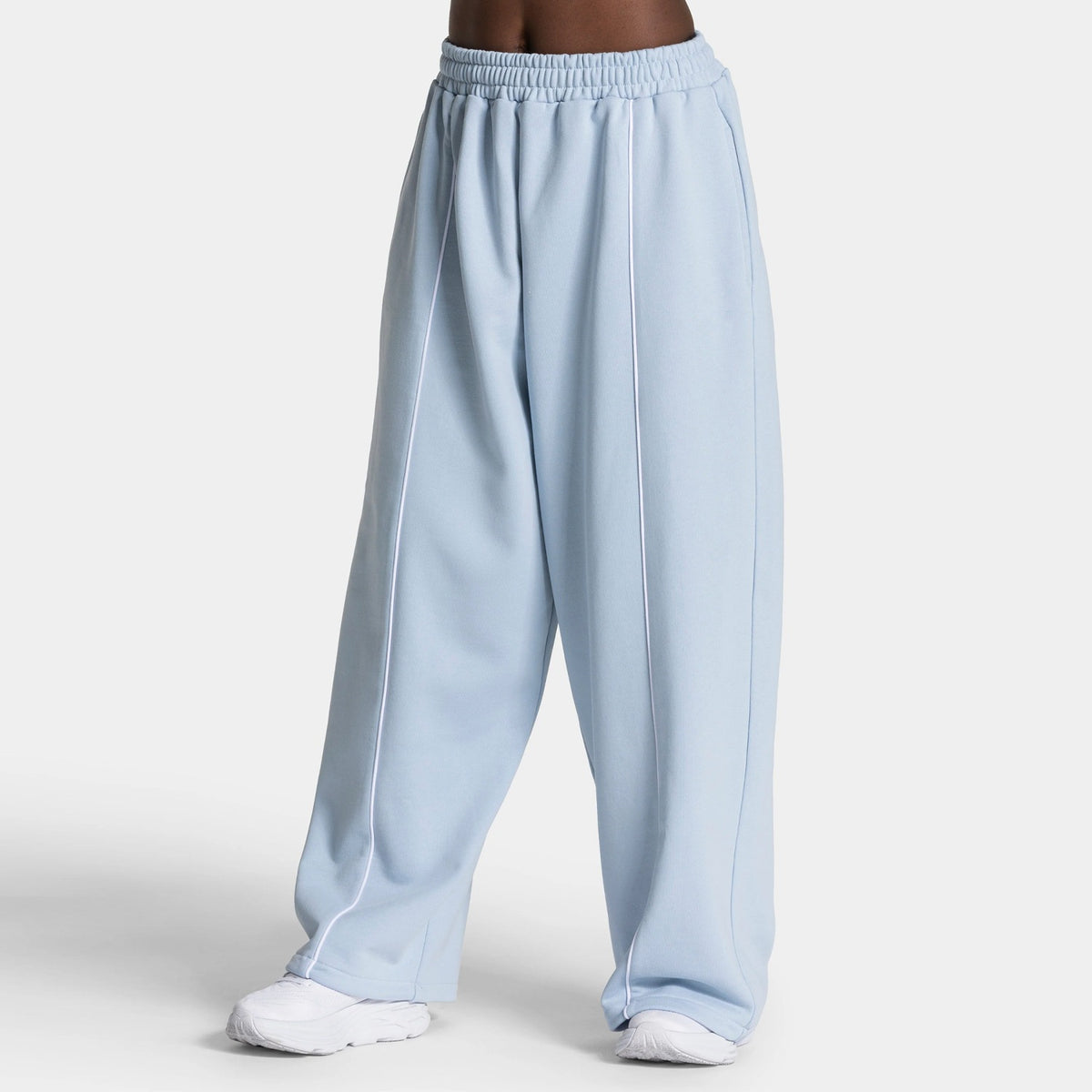 Light blue wide-leg yoga pants with elastic waistband and vertical white contrast stripe