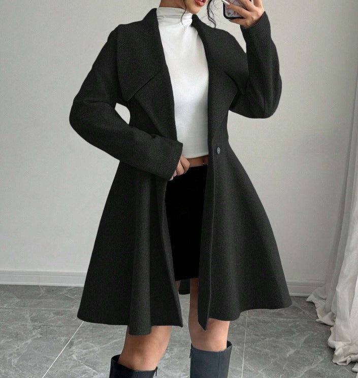 Black wool coat with notched lapels, fitted waist, long sleeves, flared A-line skirt