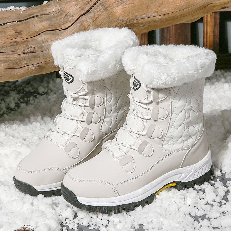 White high-top winter snow boots with fuzzy lining and lace-up straps