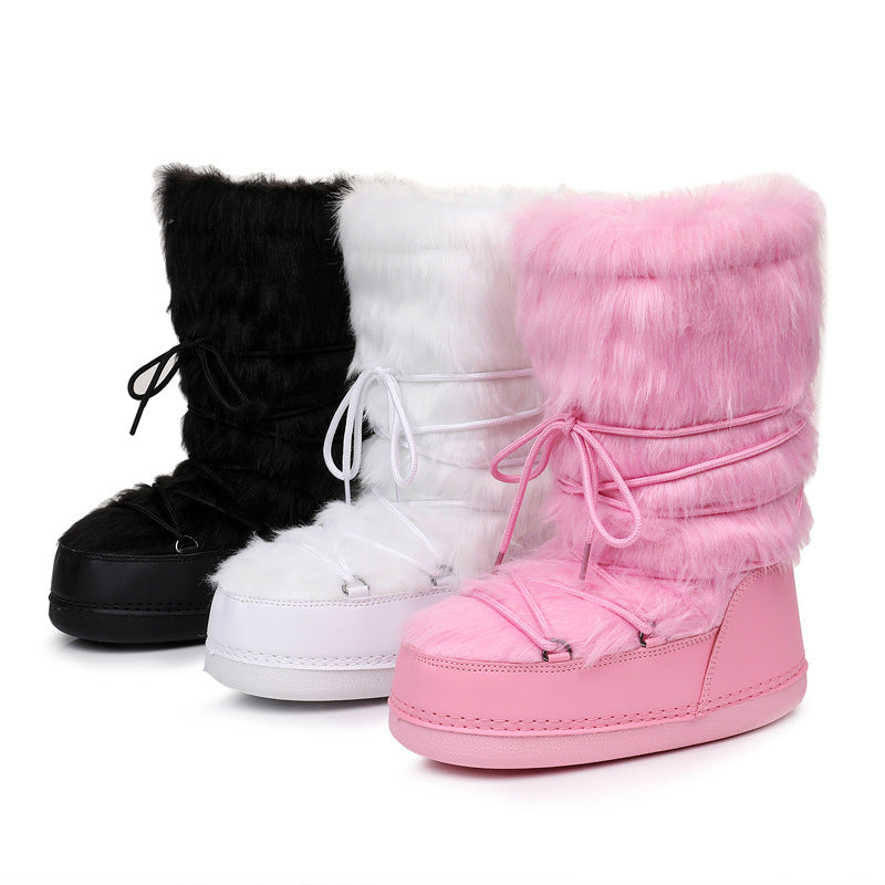 Black, white, and pink faux-fur lace-up winter boots with thick soles