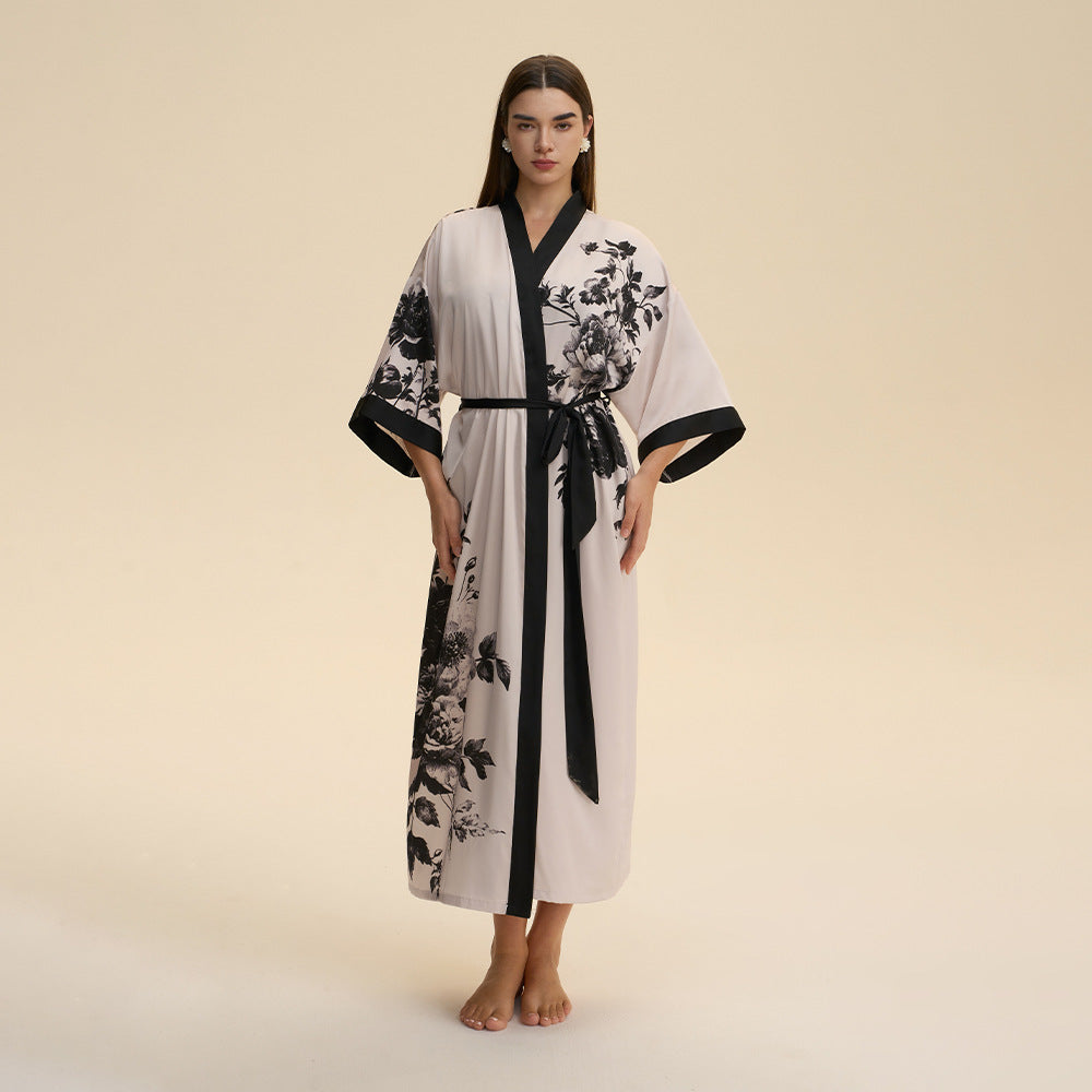 Floral satin robe with black trim, kimono sleeves, and waist tie, white with dark print