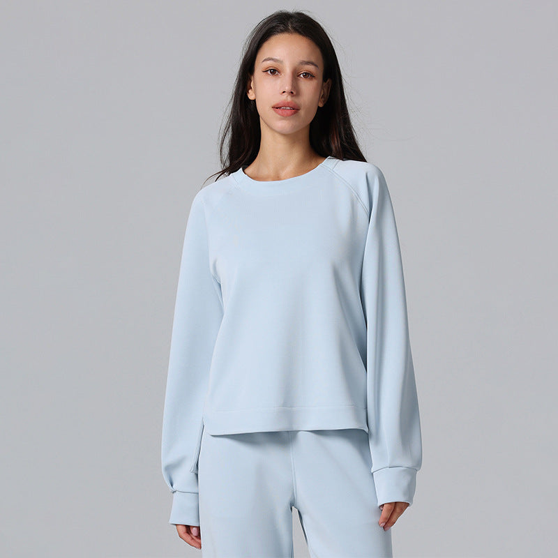 Pale blue long-sleeved pullover with a relaxed fit and ribbed cuffs