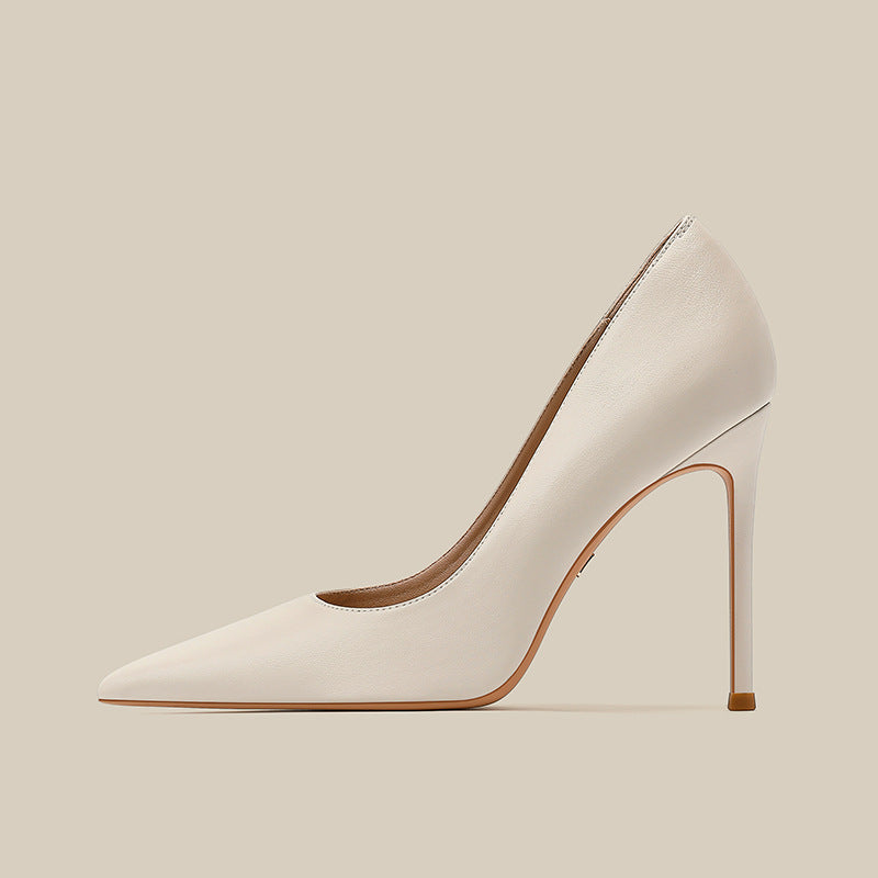 Women’s white stiletto high-heel pump with pointed toe and smooth leather upper
