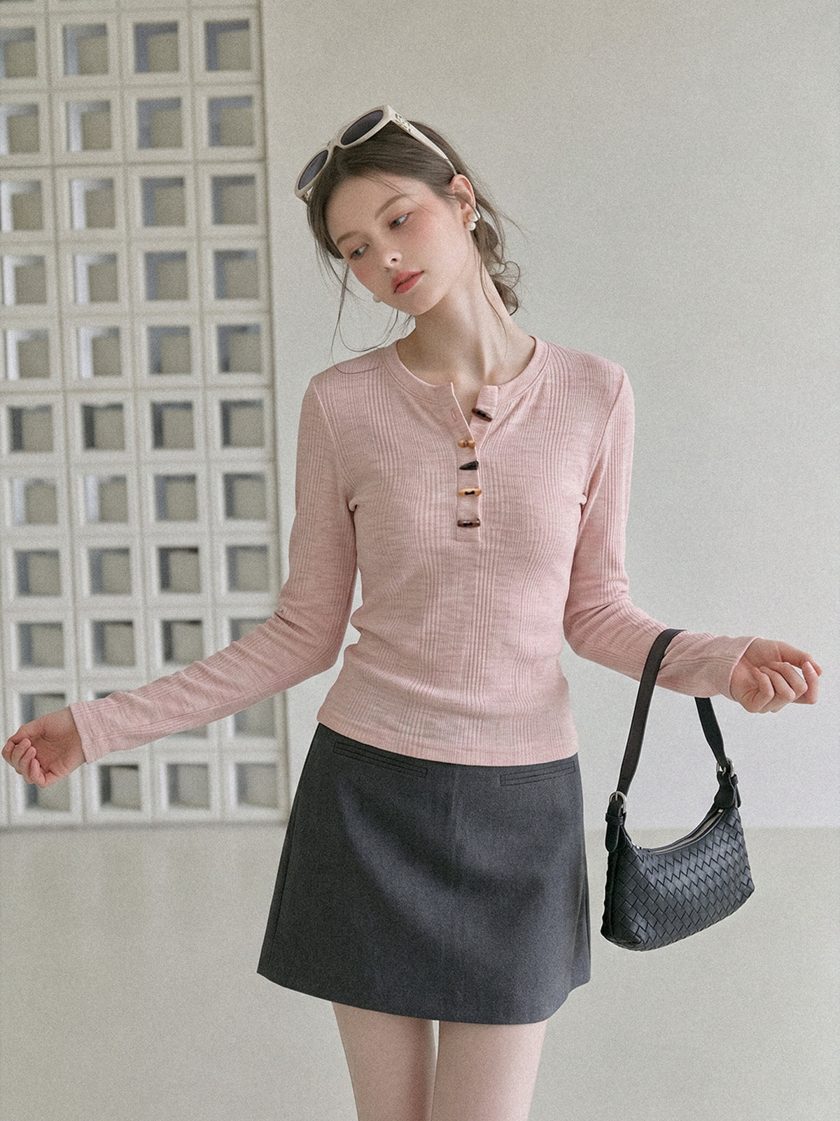 Women's pink long-sleeve henley top with horn-button placket and round collar