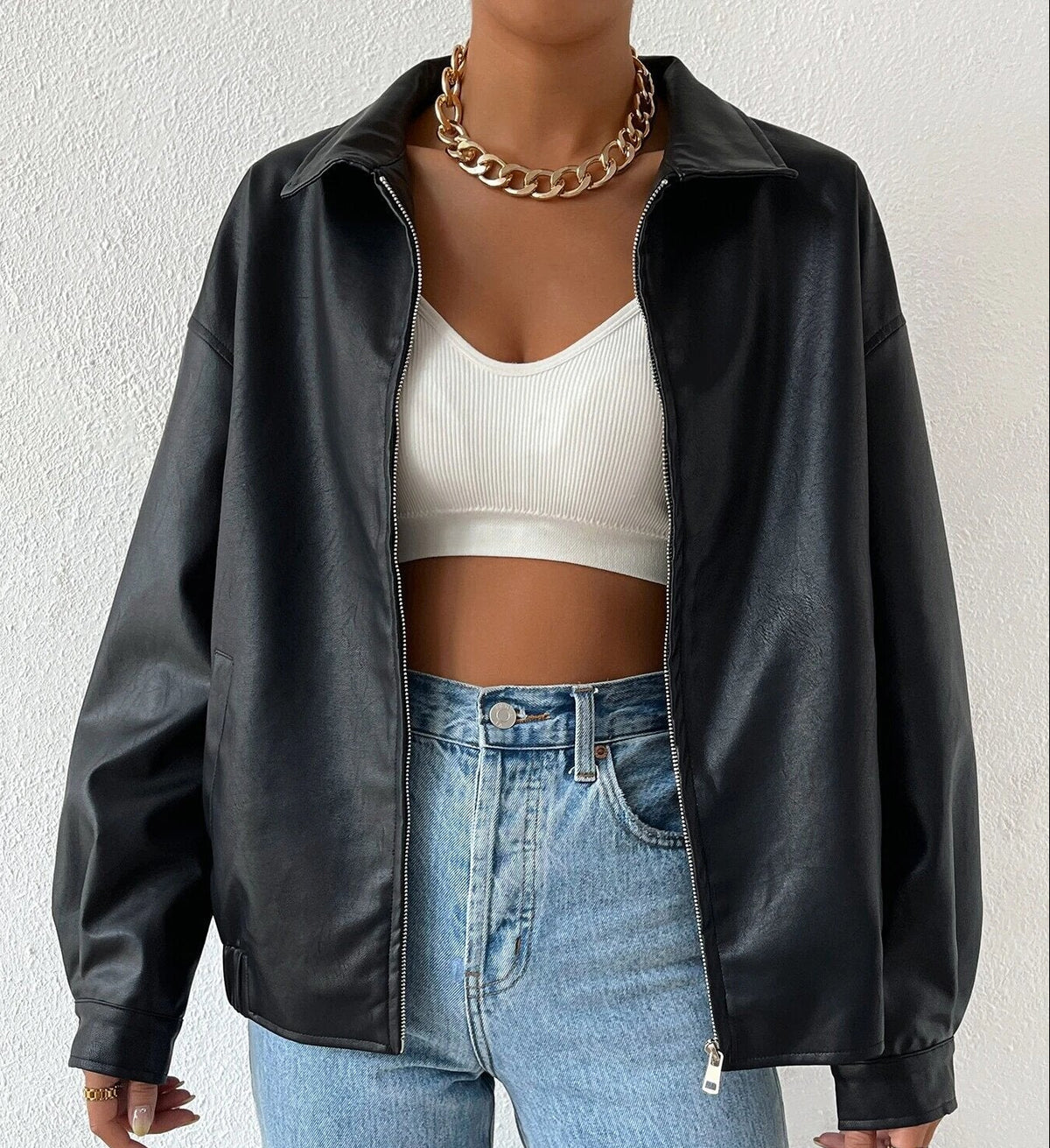Black faux-leather zip-front jacket with stand collar and relaxed oversized fit