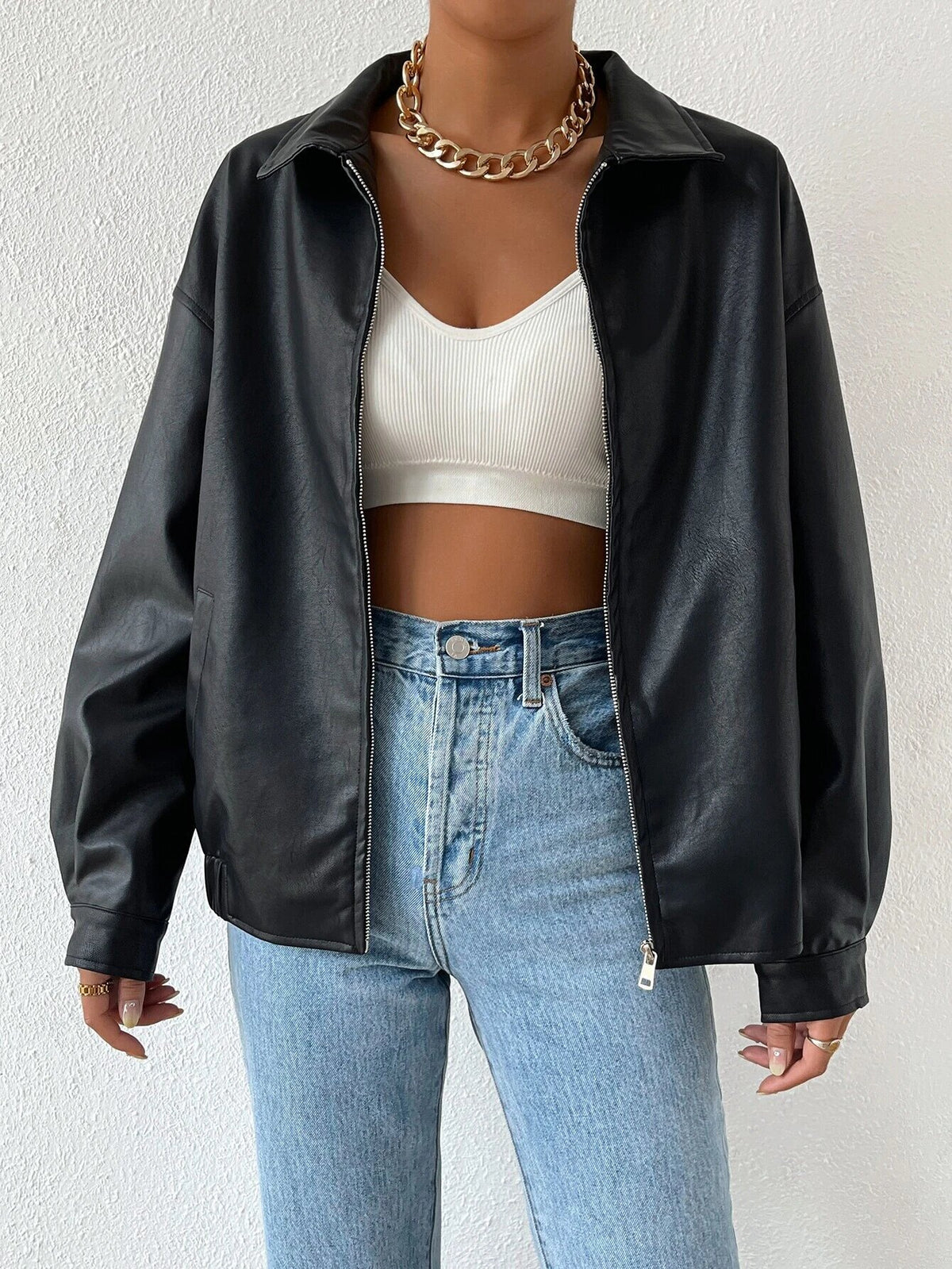 Black faux-leather moto jacket with zip front and stand collar, long sleeves