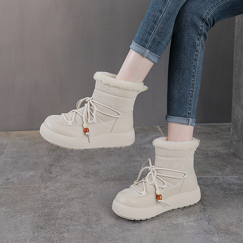 White lace-up snow boots with thick sole and soft fleece cuff trim