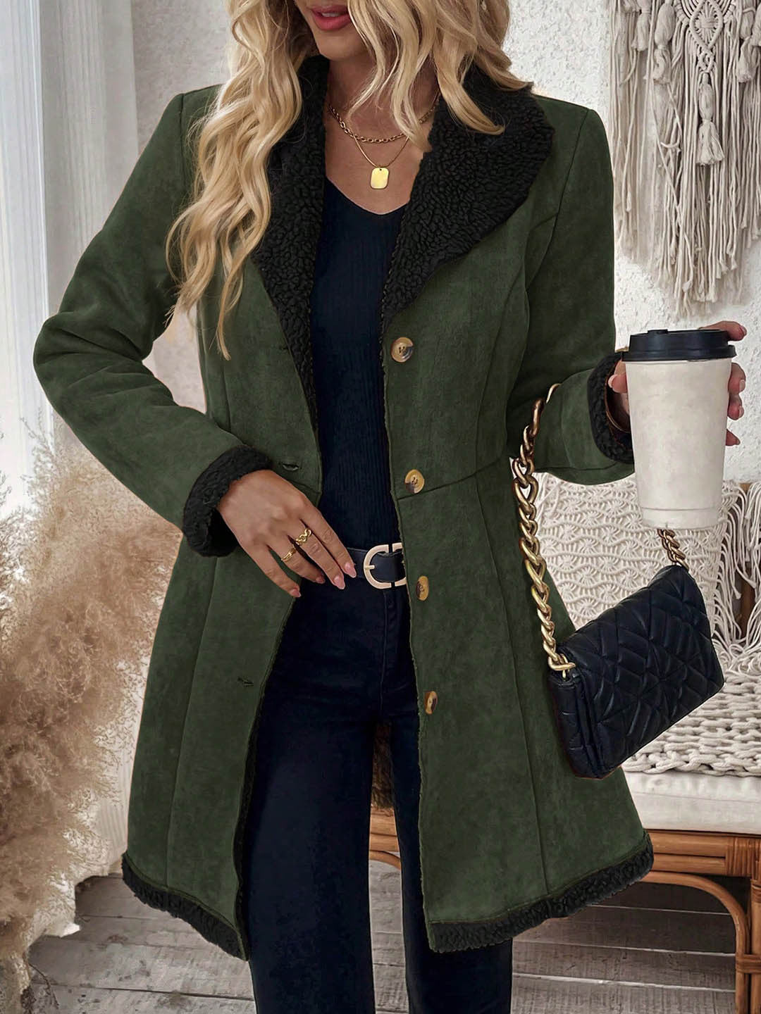 Mid-length dark green suede-look jacket with shearling-trim lapel and button front.