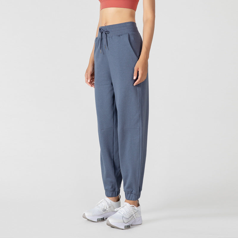 Women's high-waisted jogger sweatpants in blue-gray with a drawstring waist and cuffed ankles