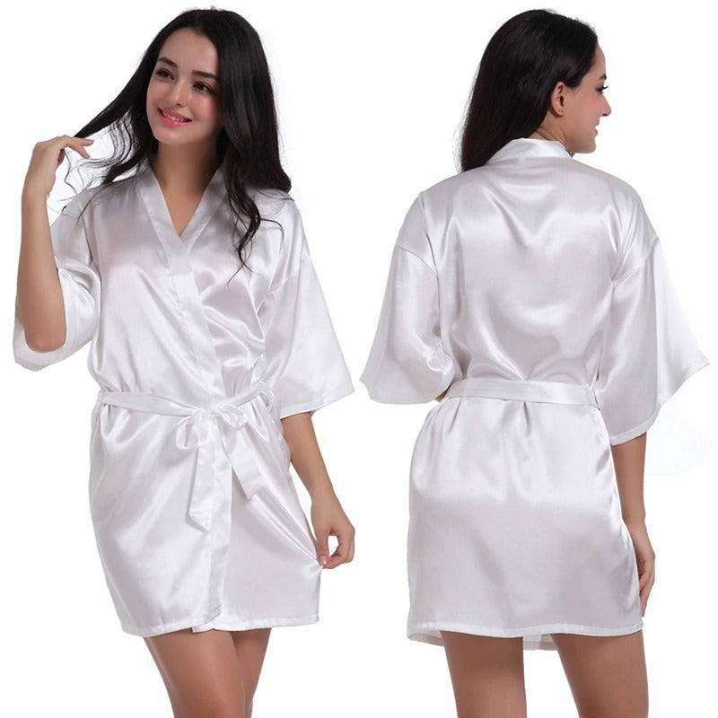 White satin short robe with V-neck and tied waist belt, half sleeves.