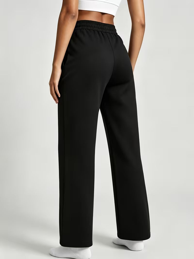Black high-waisted wide-leg casual pants with smooth drape and elastic waistband