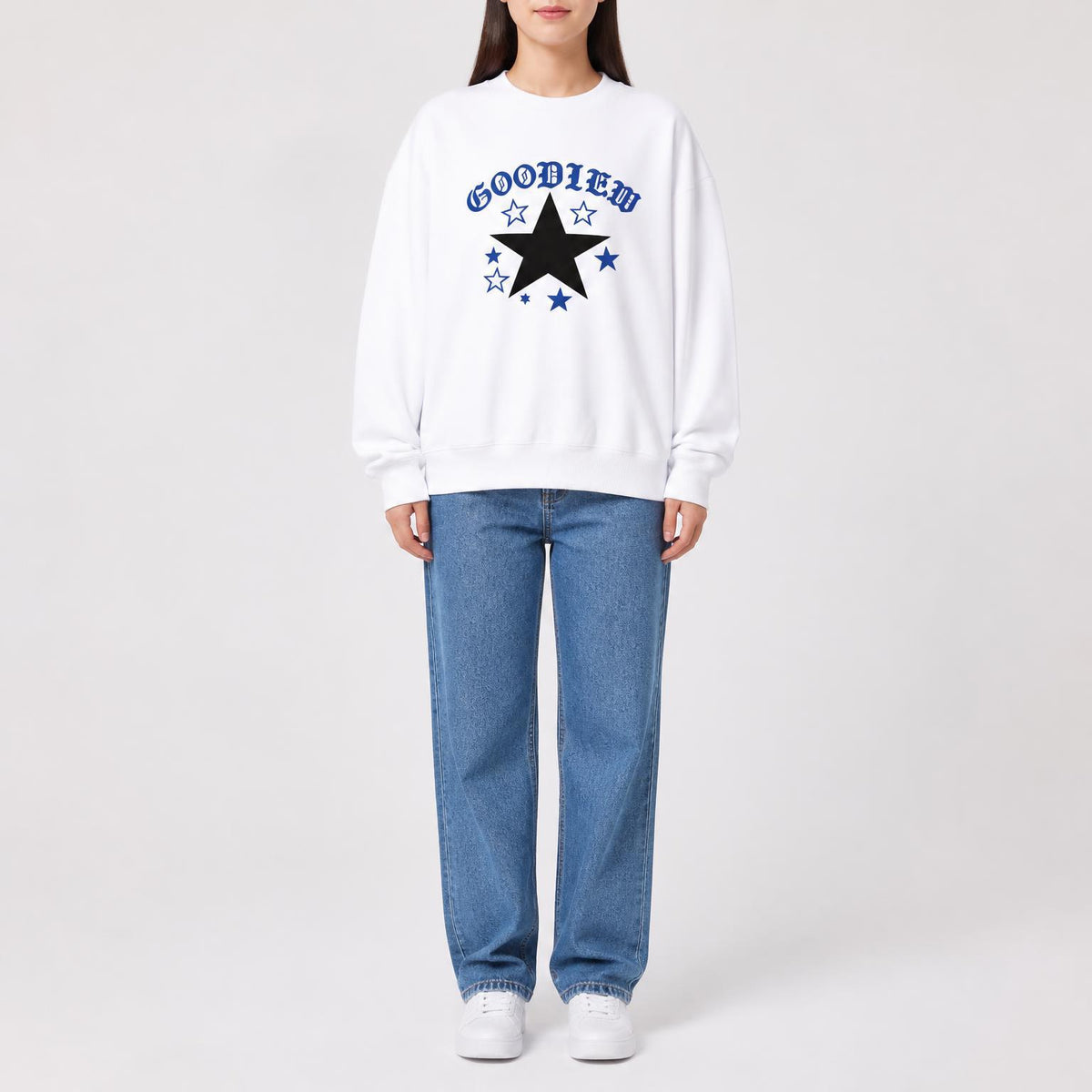 White crewneck sweatshirt with blue star graphic on chest, relaxed long sleeves