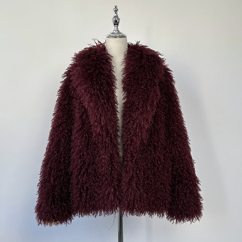 Burgundy shaggy faux fur coat with wide lapels on a mannequin, long sleeves