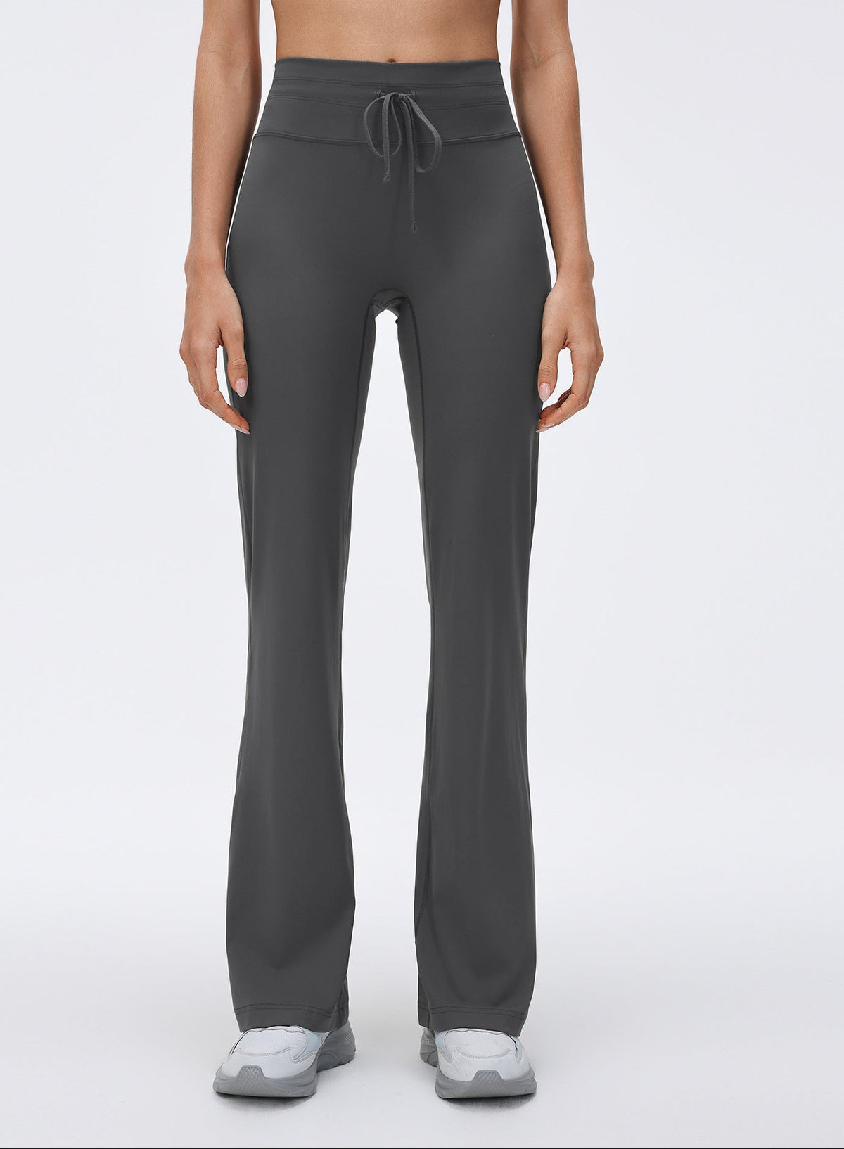 Dark gray high-waisted drawstring flared yoga pants with wide bell-bottom silhouette