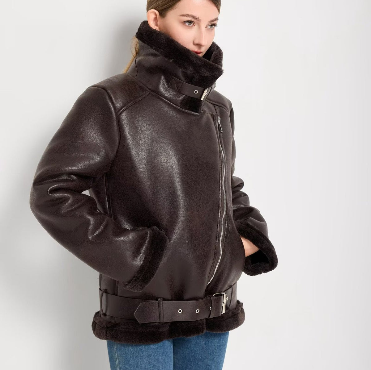 Women’s faux-fur lined leather-look coat with diagonal zipper and waist belt, dark brown