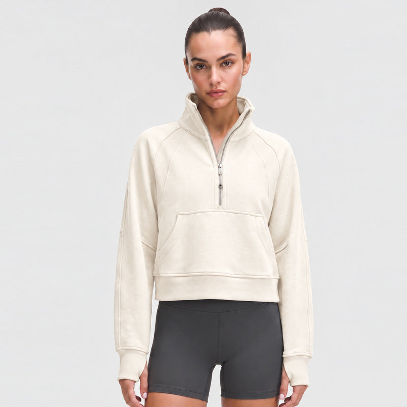 Off-white sports sweatshirt with high neck, half zip, kangaroo pocket and long sleeves